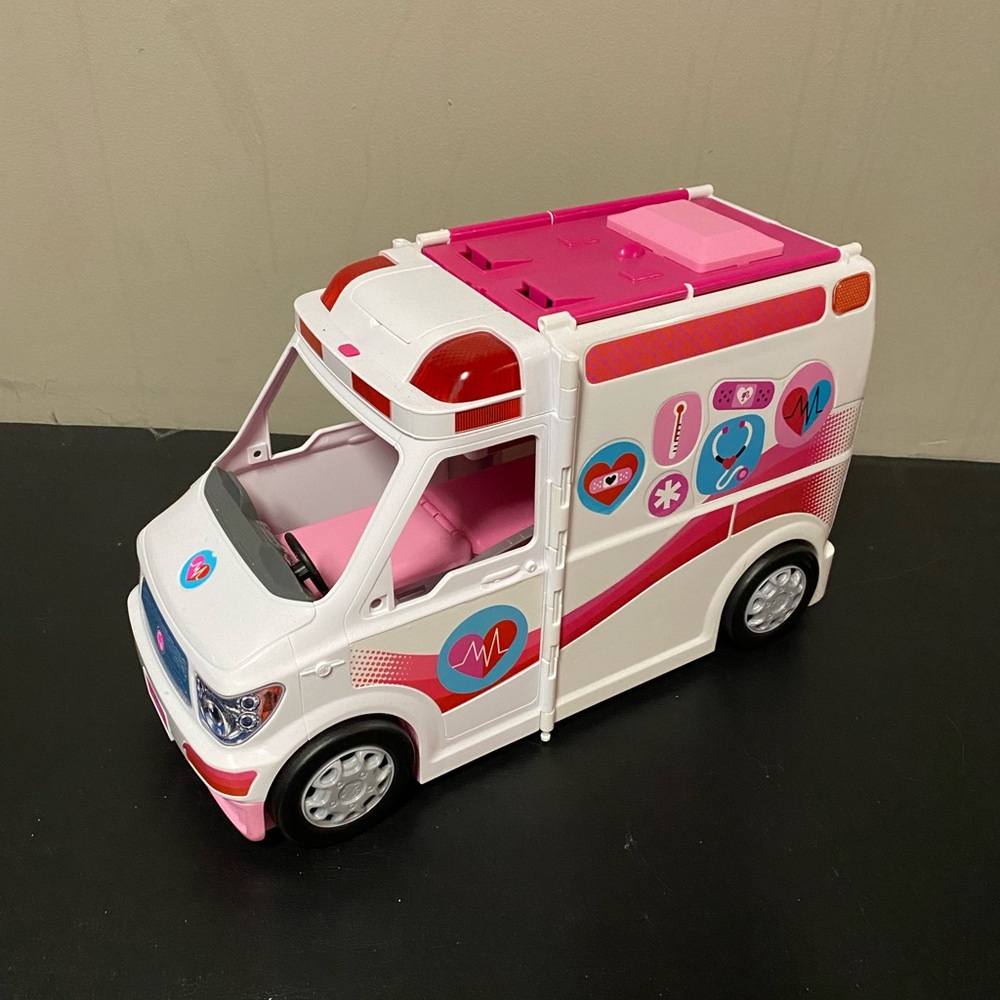 Pink and White Toy Ambulance by
